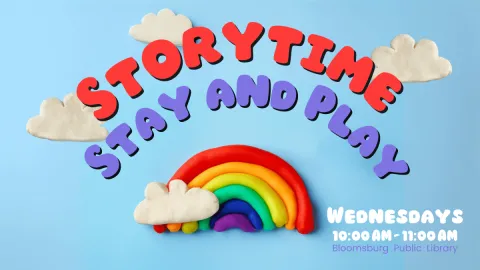 Promotional image for the 'Storytime Stay and Play' event at the Bloomsburg Public Library. The background is a bright blue, featuring colorful clay shapes, including fluffy white clouds and a vibrant rainbow. The event title, 'Storytime Stay and Play,' is written in bold, playful red and purple letters. The event details indicate that it takes place on Wednesdays from 10:00 AM to 11:00 AM.